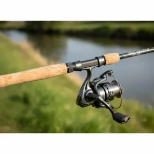 Close-up of a premium cork handle and ergonomic reel seat on a high-end UK feeder fishing rod.
