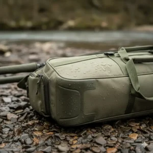 Close-up of heavy-duty waterproof fabric and reinforced base on a carp fishing rod holdall.