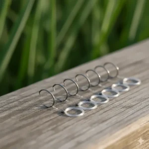 Close-up of small, fine-wire spade end hooks and light fluorocarbon line used for shy canal species like roach.