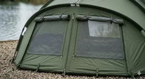 Supporting illustration showing rear mozzie mesh vents on a pram hood bivvy to improve airflow during British summer sessions.