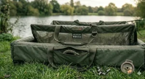 A close-up illustration focusing on the soft, fish-friendly material of a carp weigh sling, highlighting the quick-drainage mesh panels.