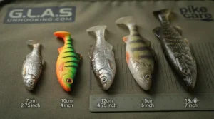 Soft plastic lure creating vibration and realistic swimming action during a steady retrieve for pike.