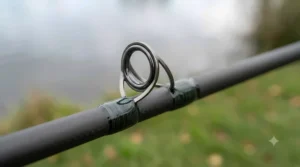 Durable ceramic guide rings on a budget-friendly catfish rod to handle heavy braided fishing line smoothly.