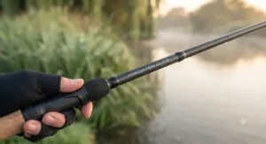 Angler testing the flexible carbon-fibre blank of a high-performance zander rod.