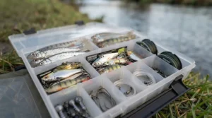 Well-organised tackle box filled with an array of top zander lures, weights, and fluorocarbon leaders.