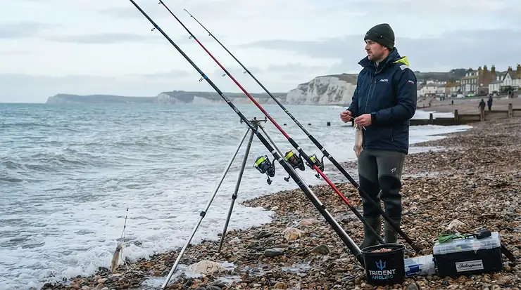 Selection of the best beachcaster rods set up on a British beach, ideal for sea fishing around the UK coast. best beachcaster rods