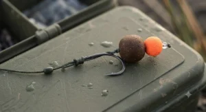 A large pellet and boilie combination hair-rigged onto a wide-gapes catfish hook for British venue tactics.