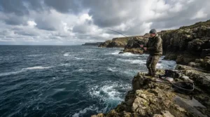 Using a fixed spool reel for long distance casting from a rugged coastal rock platform
